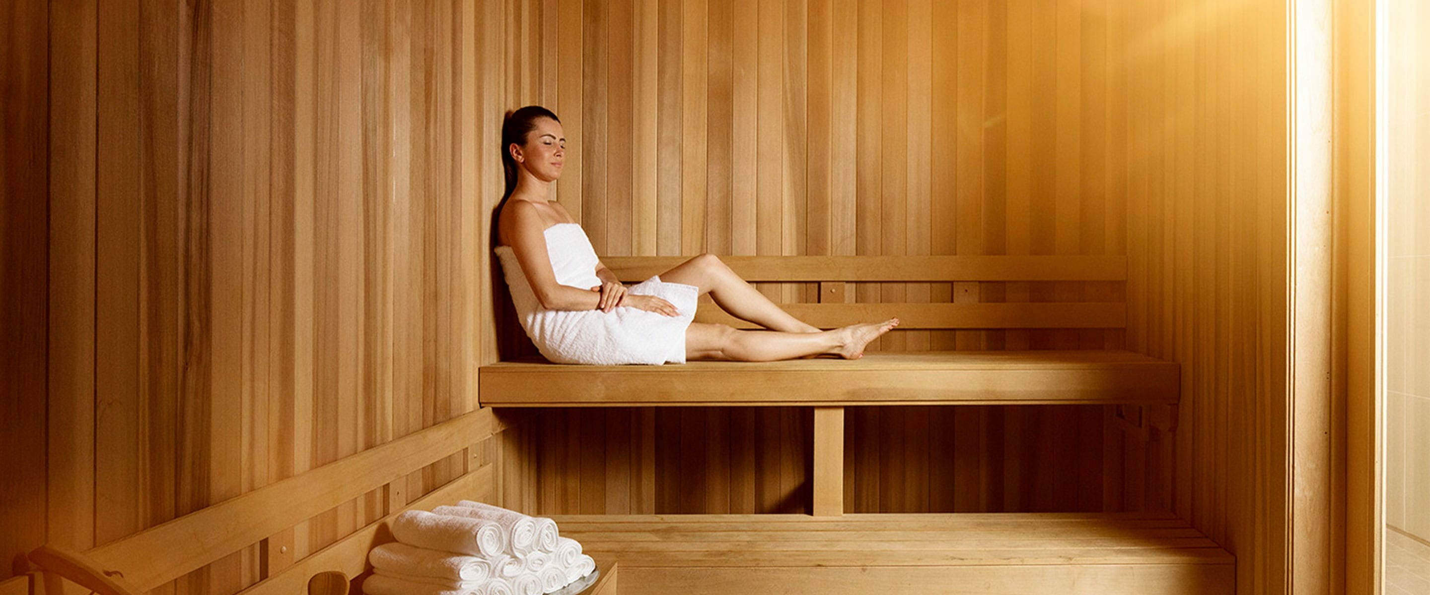 Woman relaxing in AquaVie Spa sauna