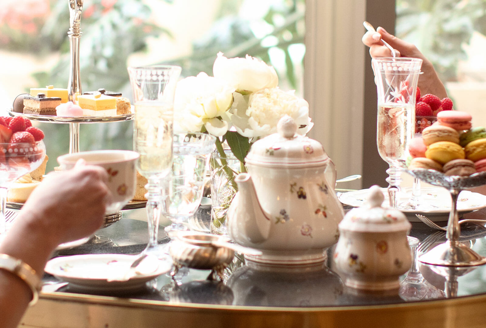 The Westgate Hotel Afternoon Tea spread with pastries and floral centerpiece