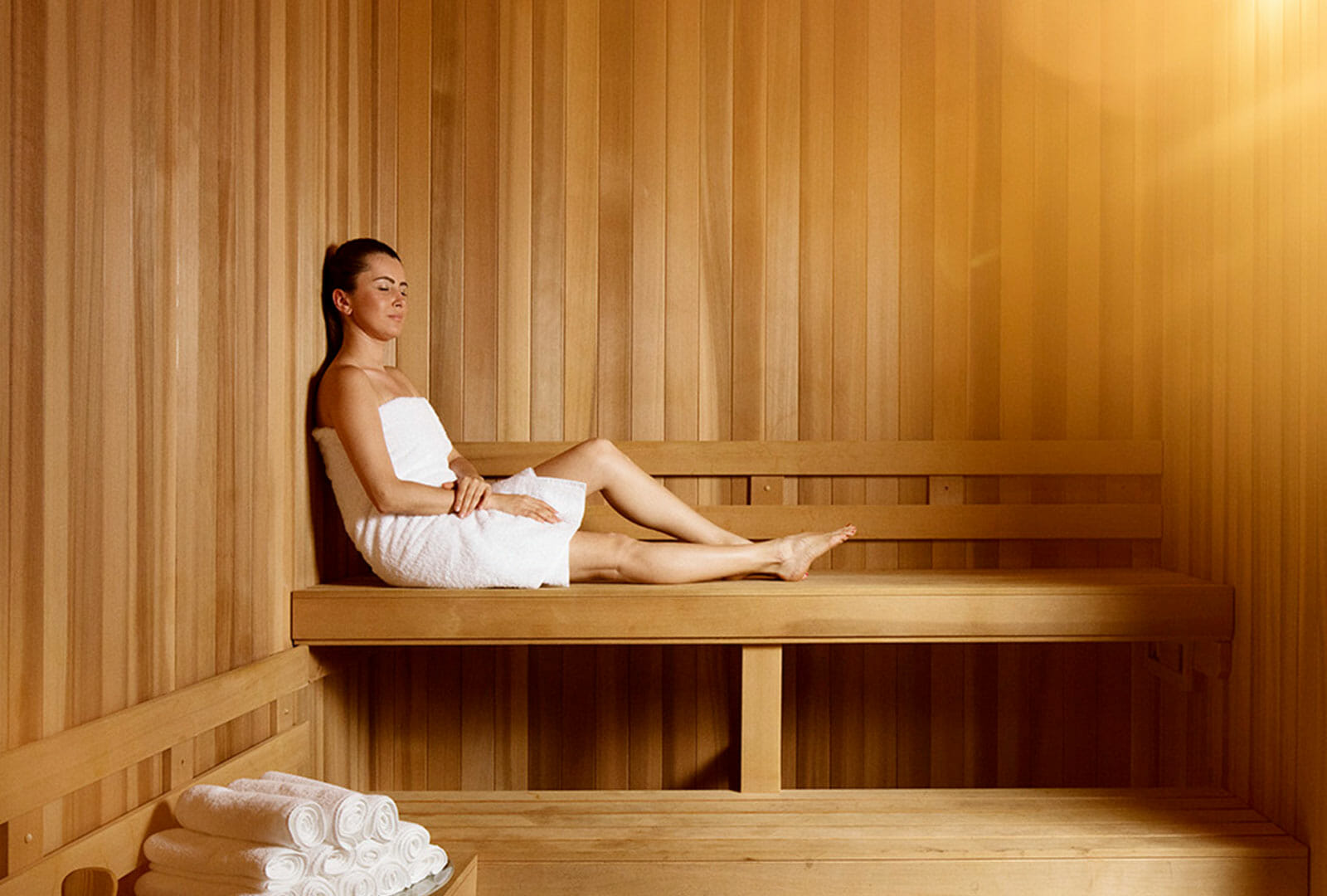 Woman relaxing in AquaVie Spa sauna