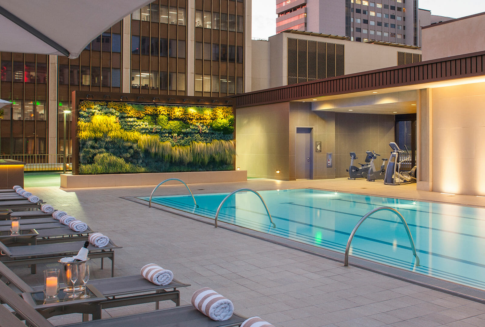 Westgate Hotel rooftop pool with lounge chairs and fitness equipment