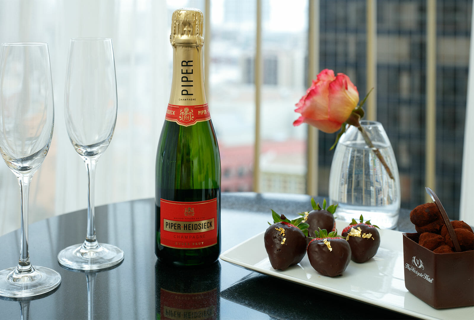 Hotel room amenities - champagne and chocolate strawberries