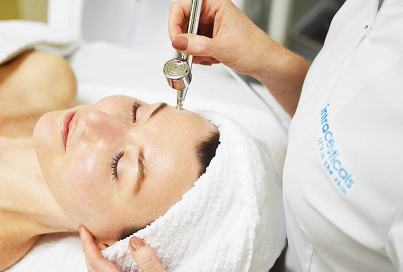 woman receiving Intraceuticals Oxygen Facial in spa.