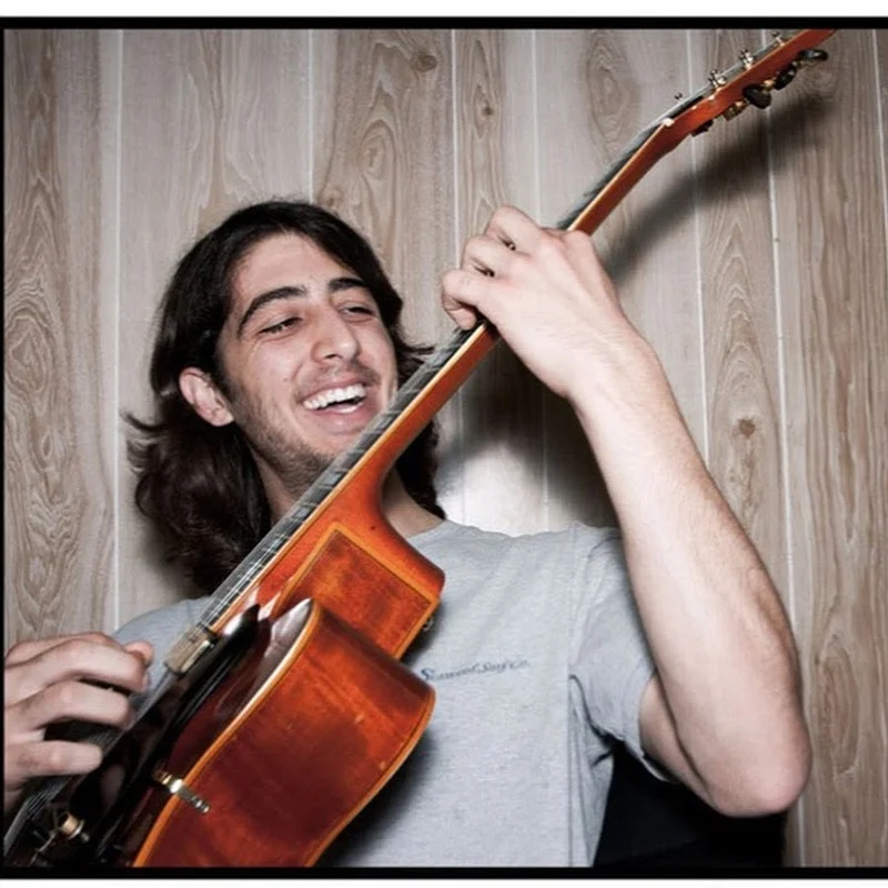 Louis Valenzuela playing the guitar